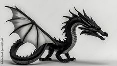 a black and white dragon figurine sitting on top of a table next to a wall