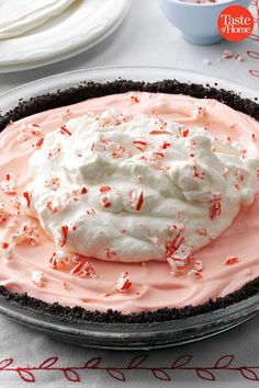 a pie with whipped cream and sprinkles on it