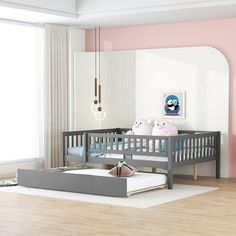 a baby's room with pink walls and furniture