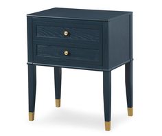 a blue nightstand with two drawers on one side and gold trim around the top, against a white background