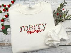 This festive Christmas sweatshirt is perfect for the holiday season. It features a pretty Christmas foliage font with the words "merry mama" in lowercase letters. The floral letters measure approximately 1.68" in height.  Each shirt is custom-made with care for you at the time your order is placed. Only quality shirts and materials are used. I primarily use JERZEES brand shirts, but on occasions, due to inventory, I may have to use a comparable brand if my supplier is out of the color or size you have selected. Shirt Details:  Adult/Unisex sizes. Medium weight 8 oz. 50/50 cotton/polyester NuBlend® pill-resistant fleece A sizing chart is available in the listing photos. Care Instructions: To maintain the quality of your sweatshirt and the embroidery design, make sure to wash with care.  Mac Christmas Foliage, Custom Embroidered Sweatshirt, Embroidered Christmas, Brand Shirts, New Mom Gift, Pretty Christmas, Mama Sweatshirt, Floral Letters, Embroidered Sweatshirt