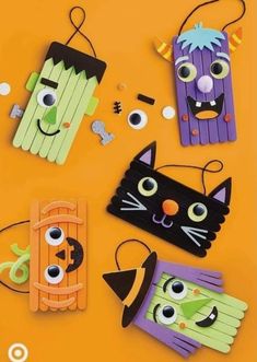 halloween crafts made out of pops sticks and construction paper