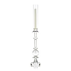 a clear glass candle holder with a single lit candle in the center on a white background