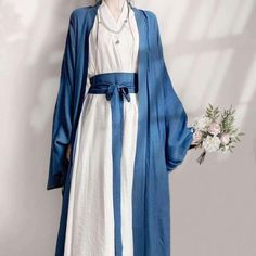 This Hanfu is designed based on ancient Chinese women's clothing from the Song Dynasty, with both inner and outer robes, and it includes a waist belt for the inner robe. * Loose fitting Hanfu dress * Inner Robe: Placket with tie closure * Outer Robe: Open-front, no closure. Drawstring cuffs * Material: Polyester * Long sleeves * Long belt * Side slit. ◆ Size S: Inner robe: Length: 49'' (125cm)  Chest: 21.5'' (55cm)  Flat measurement after tying the plackets. Sleeves: 21'' (54cm)  Outer robe: Len Traditional Asian Dress, Chinese Style Dress, Han Dynasty, Hanfu Dress, Song Dynasty, Chinese Clothing, Ancient China, Chinese Dress, Traditional Dresses