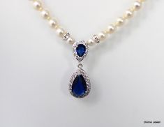 "This something blue necklace has a cubic zirconia teardrop and Austrian premium pearls. Teardrop pendant measures about 1 1/4\" long.  Pearls measure 6 mm in diameter and are accented with rhinestone rondelles.  Finished off with a silver lobster claw clasp closure and 2\" extender chain for additional length.  Please choose desired pearl color, finish and length at checkout.  The length of the necklace is from end to end. The teardrop length is not included in total length.  Keep this in mind when ordering the size that best fits your needs.  If you have any questions message me I'm happy to help! Just glamorous for any bride to be! **Please choose at checkout length, pearl color and size either 6 or 5 mm. Shown in the pictures is the 6 mm Austrian pearls** This necklace is perfect for a Elegant Blue Rhinestone Necklace For Wedding, Blue Pearl Drop Necklaces For Wedding, Teardrop Pearl Necklace For Wedding, Blue Pearl Drop Necklace For Wedding, Bridal Pearl Necklace, Pearl Necklace Wedding, Necklace Wedding, Necklace Pearl, Rhinestone Wedding