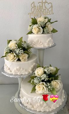 three tiered wedding cake with white flowers on top