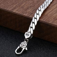 Solid 925 sterling silver. Sturdy curb chain necklace for men. Goes well with any outfit, formal or casual. Product Details Metal Type: 925 Sterling Silver Width: 5 mm Length: 18 in / 20 in / 22 in/ 24 in / 26 in / 28 in Weight: 41 g (26 in) Classic Sterling Silver Cuban Link Bracelet With Silver Chain, Classic Sterling Silver Cuban Link Necklace, Classic Sterling Silver Cuban Link Bracelet With Box Chain, Classic Sterling Silver Cuban Link Necklace Gift, Man Necklace, Mens Chain Necklace, Silver Jewelry Fashion, Sterling Silver Mens, Curb Chain