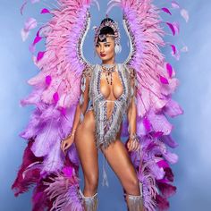 a woman in a costume with feathers on her body