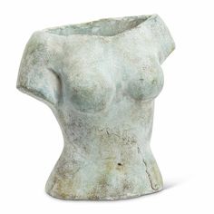 an old and dirty white ceramic vase with a breast on it's side, isolated against a white background