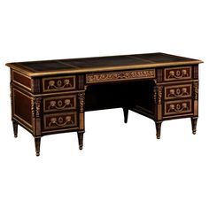 an antique style desk with drawers and carvings on the top, painted in black and gold