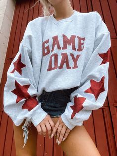 Our fan favorite "Gameday Cutie Crew" is a must have for football szn! Comes in multiple color options so you can support your fav team! This design features "game day" on the front and stars on the sleeves. Some colors come with sparkle stars and others come with regular. Cotton Blend Crew in multiple color options Materials may have natural variations Colors may vary from different viewing devices ☆For a cropped, distressed, or any additional customizations to the notes section at checkout. If Trendy Games, Cute Shirt Designs, Loose Long Sleeve, Grey Crewneck, Vintage Couture, Cute Sweatshirts, Gameday Outfit, Y2k Streetwear, Oversized Sweatshirt