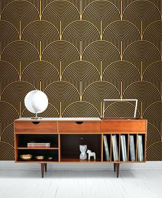 an art deco wallpaper design in black and gold, with a bookcase on the side