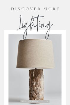 a lamp with the words discovering more lighting on it and an image of a tree stump