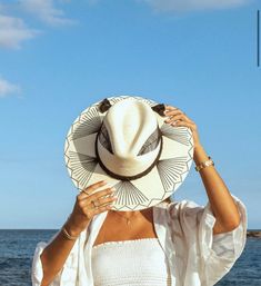 White Palm Wide Brim Hat with Black Feather Design. Custom designed and hand made hats by artisans in San Jose Del Cabo, Mexico. These hats are one size fits most with an elastic band inside to add comfort and fit for all head sizes. Each hat has a 3-4 week turnaround.  Please note, all hats come with natural braid unl Black Handwoven Short Brim Hat, Artisan Black Hat For Summer, Artisan Beach Hats One Size, Adjustable Handwoven Black Hat, Adjustable Black Handwoven Hat, Artisan Beach Hat, Black Bohemian Panama Hat With Curved Brim, Adjustable Artisan Panama Hat For Kentucky Derby, White Artisan Hat With Short Brim