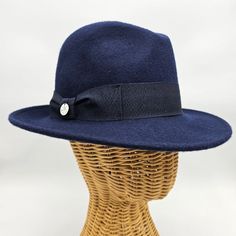 Step back in time with our Women's 1930's Wool Felt Hat, a timeless accessory that channels the elegance and grace of a bygone era. Crafted with meticulous attention to detail, this hat is inspired by the iconic fashion of the 1930s, offering a perfect blend of vintage charm and modern sophistication. Made from high-quality wool felt, this hat boasts a classic silhouette that captures the essence of 1930s style. With its medium brim and tailored design, it exudes understated elegance and complem Adjustable Curved Brim Gatsby Hat, Gatsby Style Adjustable Hat With Curved Brim, Adjustable Gatsby Hat With Curved Brim, Vintage Adjustable Fedora In Solid Color, Vintage Adjustable Fur Felt Fedora, Vintage Adjustable Fedora, Vintage Adjustable Solid Fedora, Classic Solid Color Cloche Hat, Elegant Solid Cloche Hat With Short Brim