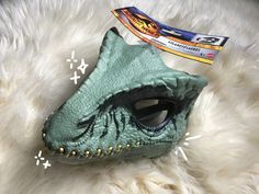 -all items are 100% eco freindly - new giganotosuarus mask! Paintable with acrylic, this raptor mask has a completely movable jaw and adjustable head strap. You can see clearly through the eyes and it's fully hinged.  -this mask is quite rare because of the fact that it's so hard to find, and because it's value has gone up in recent months To clean, I would wipe over it, inside and out, with rubbing alcohol. Then wipe it off with a wet or damp cloth. -don't completely submerge in water, may rust Raptor Mask, Dino Mask Paint Ideas, Eco Freindly, Dino Mask, Dinosaur Mask, Fnaf Cosplay, Rubbing Alcohol, Paint Ideas, 2 Months