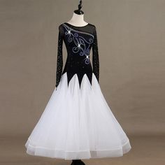 a white and black dress with sequins on it