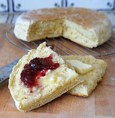 there is a piece of bread with jam on it and a knife next to it