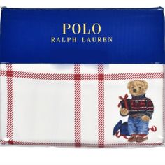 the polo bear is wearing a sweater and jeans