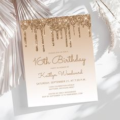 an elegant birthday party card with gold glitter drips and palm leaves in the background