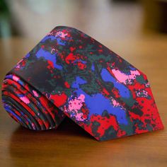 Introducing Our Vibrant Silk Necktie: The Watercolor Symphony Dive into a world of color and creativity with our latest masterpiece, the Watercolor Symphony silk necktie. Crafted from luxurious silk and adorned with an abstract watercolor pattern in shades of red, blue, and pink, this necktie is a celebration of artistic expression and individuality. Available in two widths to suit your personal style: the classic 3.4" inches for a timeless look, or the slim 2.5" inches for a modern edge. Choose Brown Bow Tie, Grey Bow Tie, Yellow Bow Tie, Light Pink Shirt, Purple Bow Tie, Vibrant Fashion, Polka Dot Bow Tie, Green Bow Tie, White Bow Tie