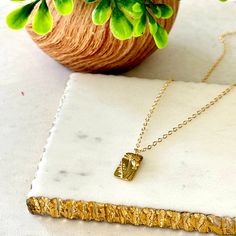 This beautiful Dainty Tag Floral Pendant Necklace adds a sweet and subtle touch of femininity to any look! Perfect for everyday wear or special occasions; style it alone or layer with a choker necklace for a boho-chic look. 14K Gold Filled Chain 16” plus 2” extender 1.3mm Rolo Cable chain 14K Gold Filled Whimsical Flower Pendant: 9x17mm Tarnish-Resistant Made in the USA! Ships from Missouri Delicate Necklace With Rectangular Pendant, Dainty Everyday Necklace With Rectangular Pendant, Dainty Adjustable Layered Necklace As Gift, Dainty Necklace With Rectangular Pendant, Delicate Adjustable Layered Necklace For Gift, Dainty Necklace With Delicate Chain And Rectangular Pendant, Delicate Everyday Necklace With Rectangular Pendant, Delicate Square Pendant Necklace For Everyday, Delicate Rectangular Pendant Necklace For Everyday