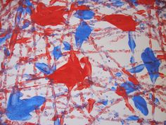 a painting with red, white and blue paint on it that looks like birds in the sky