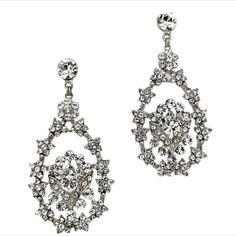 These eye-catching bold chandelier earrings feature delicate crystals and a soft floral pattern all around. With its glamorous and elegant design, this stunning bridal pair is sure to stand out on any special occasion. Available in all crystal or crystal with pearl detailing. -Genuine Crystals -Approximately 1.5in from widest point x 3in long (3.81cm x 7.62cm) -Rhodium or Vintage Gold plated, non-tarnish finish for brilliance Crystal Jeweled Bridal Earrings For Wedding, Crystal Drop Earrings For Bridal Glamorous Events, Crystal Drop Earrings For Glamorous Events, Crystal Jeweled Chandelier Earrings For Wedding, Wedding Crystal Jeweled Chandelier Earrings, Elegant Crystal Bridal Earrings For Glamorous Events, Elegant Jeweled Chandelier Earrings For Wedding, Glamorous Crystal Chandelier Earrings For Glamorous Events, Jeweled Crystal Earrings For Weddings