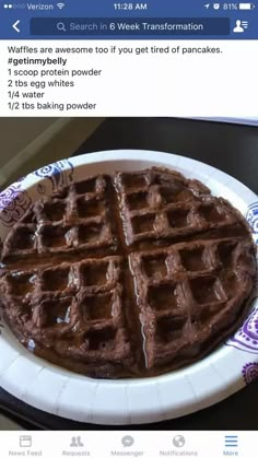 a waffle on a plate with chocolate icing