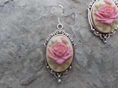 "For sale are beautiful flawless (perfect pink rose with a single bud, with green leaves on a tan/beige background) cameo pendant necklace and matching earrings set The cameos are gorgeous, very detailed They are offered at a reasonable price, make perfect gifts, and are wonderful quality The cameo is set in an ornate tibetan silver setting, and the chain is 22\" .925 silver plated 1.2mm snake chain, with a lobster claw clasp The earrings match perfectly, and the earring hooks are .925 silver pl Cameo Pendant Necklace, Cameo Necklace, Cameo Pendant, Perfect Pink, Beige Background, Earring Hooks, Necklace And Earrings, Snake Chain, Earrings Set