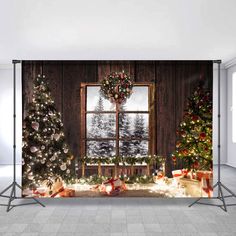 christmas trees and presents in front of a window