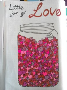 an open book with hearts in a jar on the page, and writing that reads little journal of love