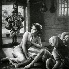 an old black and white photo of two women sitting on the floor next to a statue