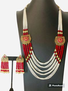 A beautiful pearl necklace with red beads have unique design is all set to dazzle your look at any party. This elegant necklace is a perfect which all women is looking for. Setting class of its own, it is a perfect necklace to be gifted as well as for personal use. Made with Pearl and red beads gold work. Long necklace pattern . Set include 1 set of earrings. Care instruction: Always keep your jewelry in a box or a pouch and keep it in a dry place. Keep it away from water, perfume and excessive heat. As soon as you remove it, thoroughly wipe each piece of jewelry with a soft, lint free cloth to maximize brilliance. if customization is required, plz feel free to contact me any time. All listings come in a professional gift box with a complimentary gift wrap option. Please advise if this is Elegant Red Jewelry Sets For Festive Occasions, Elegant Red Long Beaded Necklace, Elegant Long Red Beaded Necklace, Red Long Necklace For Party, Red Jewelry Sets For Formal Festivals, Elegant Red Kundan Necklace For Festive Occasions, Elegant Red Long Necklace With Round Beads, Beaded Long Bridal Necklace For Party, Beaded Long Bridal Necklace