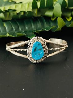 Navajo Made Kingman Turquoise Sterling Silver Cuff Bracelet. It measures 1 inch wide with an inside circumference of 5 3/8 inches and a gap of 1 1/8 inches. Signed by the artist and stamped sterling silver.   Thank you for checking out my store, if you have any questions please contact me!!    Exported By ExportYourStore :) SKU:490865486400_6B23* Western Style Blue Cuff Bangle Bracelet, Western Turquoise Bangle Cuff Bracelet, Western Style Turquoise Bangle Cuff Bracelet, Western Style Blue Bangle Jewelry, Western Style Blue Cuff Bracelet Gift, Southwestern Turquoise Bangle, Sterling Silver Cuff Bracelet, Kingman Turquoise, Sterling Silver Cuff