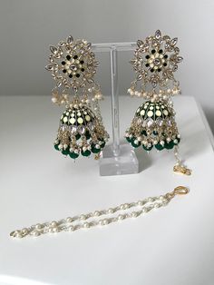 A stunning pair of hand painted Kundan Indian jhumkas/jhumki earrings.  These earrings come in a variety of different colours.   These are very lightweight and can be worn with all outfits.   Please follow our instagram page - Sakavano Jewellery Please note we do not offer refunds or exchanges due to hygiene reasons. Handmade Green Bohemian Jhumkas, Green Cutdana Chandbalis For Party, Green Chandbalis With Tilla For Festive Occasions, Green Chandbalis With Latkans For Party, Festive Green Chandbalis With Tilla Detail, Green Bohemian Dangle Jhumkas, Green Cutdana Bridal Earrings For Party, Festive Green Danglers With Latkans, Green Dangle Chandbalis With Latkans