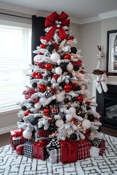 a christmas tree decorated with red, white and black ornaments