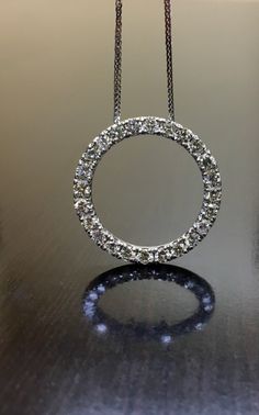 "DeKara Designs Clearance Metal- 14K White Gold, .583. Stones- 24 Round Diamonds, F Color VS2 Clarity, 1.75 Carats. Classic \"Circle of Life\" diamond pendant is made in 14K white gold and features 24 round brilliant cut diamonds which are \"U\" pave set. These diamonds are all colorless with great fire and extremely vibrant. This is a necklace that will be loved and cherished forever. Could be worn every day, or for a fancy evening/special event. The pendant is an inch in circumference. Necklac 14k White Gold Diamond Necklace, White Gold Diamond Necklace, Eternity Necklace, Pink Sapphire Pendant, Gold Moon Necklace, Necklace Diamond, Circle Diamond, Gold Diamond Necklace, Moonstone Jewelry