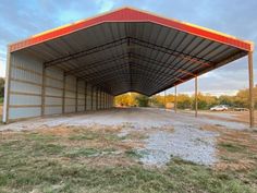 an empty parking garage in the middle of a field