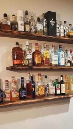 13 Hanging Bar Shelves - DIY Bar Shelf Ideas Bar Shelf Kitchen, Diy Floating Bar Shelf, Home Wall Bar Ideas, Bar Lights Kitchen, Bar Liquor Display Shelves, Bar Stand Ideas For Home, Floating Shelves Bar Ideas, Floating Shelves For Bar Area, Liquor Wall Display Bar Ideas