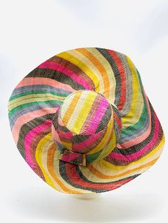 Approximately 5" Brim: Monica Estrella Handmade loomed raffia palm fiber these hats are mailable, stylish, and protect you from the sun. Foldable. Packable. Style the hat to fit your purpose & personality. Multicolor stripe patterns make a fun swirl design around the crown and brim of the hat. Raffia Palm, Linen Bottoms, Wedding Pets, Linen Romper, Hat Handmade, Blue Rainbow, Bachelorette Gifts, White Floral Dress, Linen Shop