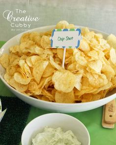 a bowl filled with chips sitting on top of a table