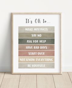 a framed poster with the words it's ok to be in different colors and font