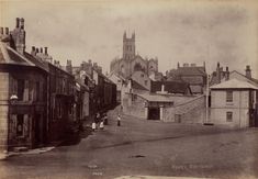 an old black and white photo of some buildings