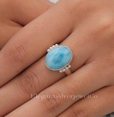 Dominican Larimar Ring / 925 Sterling Silver Ring / Oval Gemstone Ring / Bohemian Jewellery / Anniversary Gift For Wife Gemstone Name - Larimar Stone Quality - AAA Ring Wight - 4.88 gm  Ring  Length -1.7 cm  Ring  Width - 1.7 cm Stone Shape - As shown in the picture Ring Size - All Ring Size Available You'll get the exact product as shown in the pictures We serve complete 925 sterling silver Jewelry and genuine properties of the stone. The products are dispatched from the small business from USA. Product Quality and Packaging - Our all products are 925 Silver Stamped which shows that the product is genuine and authentic .The products are dispatched from the small business from USA so you get the product on time and the product packaging comes in bubble foil wrap with all the precautions ta Elegant Larimar Rings For Anniversary, Oval Silver Larimar Turquoise Ring, Elegant Oval Larimar Rings, Oval Larimar Jewelry For Anniversary, Oval Larimar Rings For Anniversary, Oval Larimar Gemstone Rings, Oval Natural Stone Rings For Anniversary, Oval Rings With Natural Stones For Anniversary, Oval Natural Stones Anniversary Rings