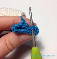 the crochet hook is being used to make an ornament