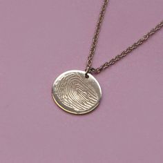 The Chiara necklace is a light gold round disc necklace that you just NEED. Whether you wear it alone or stacked, with your another necklace or bare alone- it's perfect. Add a personal touch to your Chiara necklace with an engraved fingerprint of a loved one. If you can dream it- we can make it happen. Chain Length: Length: 42cm/16" (extension: 3cm/1.8") Total 45cm/18" Element: Size: 10mm All features can be customized! Talk to us, we love making custom designs. Our jewelry is carefully handmade in our atelier Etched Sterling Silver Round Necklace, Everyday Etched Round Pendant Necklaces, Everyday Etched Round Pendant Necklace, Etched Round Rose Gold Jewelry, Minimalist Etched Round Pendant Necklace, Minimalist Hand Stamped Pendant Necklace, Hand Stamped Minimalist Pendant Necklace, 14k Gold Hand Stamped Charm Necklaces With Round Pendant, Sterling Silver Etched Round Disc Necklace