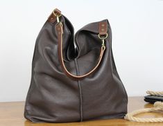 Oversized Brown Leather Hobo Bag, Everyday Large Leather Bag, Soft Leather Hobo Bag, Everyday Handbag for Women, Large Hobo Leather Bag **Dimensions Height: 18,5 inch (47 cm) Width: 18,1 inch (46 cm) Length of handle: 19,3 inch (49 cm) Bottom width: 13,4x 5,9 inch (34x15 cm) Internal pocket: 8,7x 6,7inch (22 x 17 cm) Large, very roomy bag made of thick yet soft cattle leather. The bag can be worn as a shoulder bag. Detachable shoulder strap. There is a lot of space and you can put there everythi Simple Leather Bag, Soft Leather Hobo Bag, Everyday Shoulder Bag, Slouch Bag, Slouchy Bag, Large Leather Bag, Slouch Bags, Leather Weekender, Soft Leather Bag