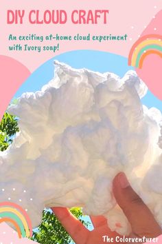 a hand holding up a large cloud in front of a rainbow - colored background with the words, diy cloud craft an exciting at - home cloud experiment with ivory soap