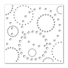 a paper cutout with circles and dots on the bottom, which is white in color